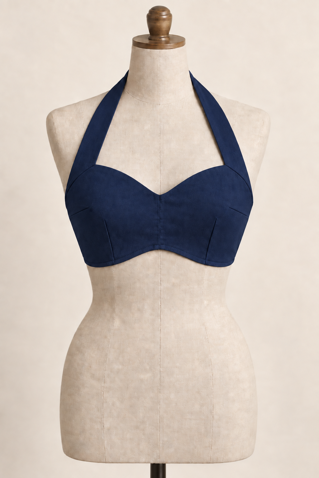AI front preview of the same darted halter beach bra in deep navy, retaining its broad straps and curved short hem
