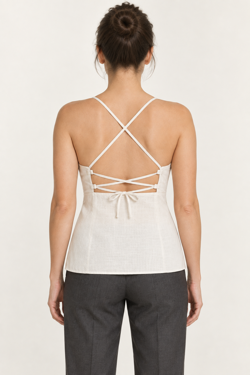 AI preview: cream camisole rear with crossed shoulder straps, narrow upper-back lacing and a closed lower-back panel.