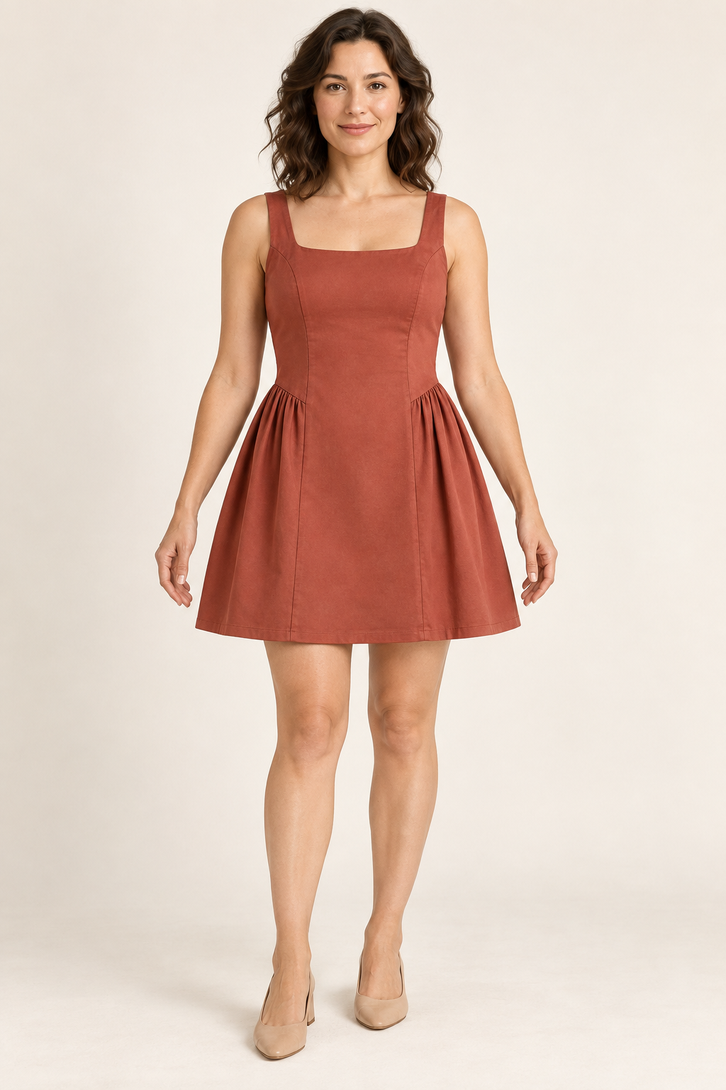 AI preview: muted-brick square-neck mini dress with a smooth continuous front panel and gathered side-skirt inserts.
