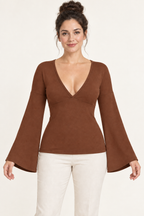 AI design preview: cinnamon version of the same V-neck knit top with an underbust join, dropped shoulders and flared wrist openings.