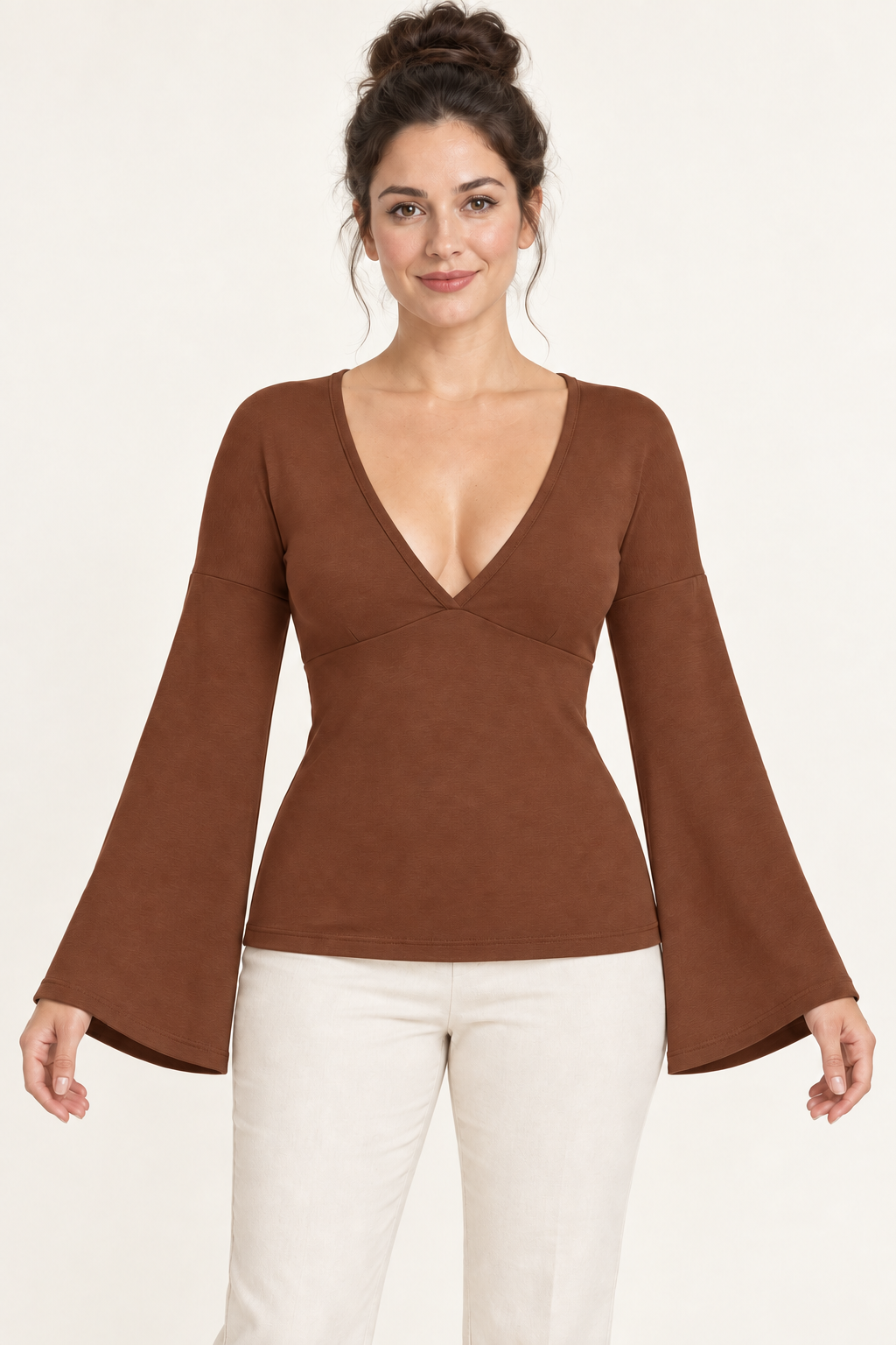 AI design preview: cinnamon version of the same V-neck knit top with an underbust join, dropped shoulders and flared wrist openings.