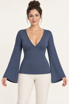AI design preview: slate-blue fitted knit top with a bound V neckline, shaped underbust seam and long continuous bell sleeves.