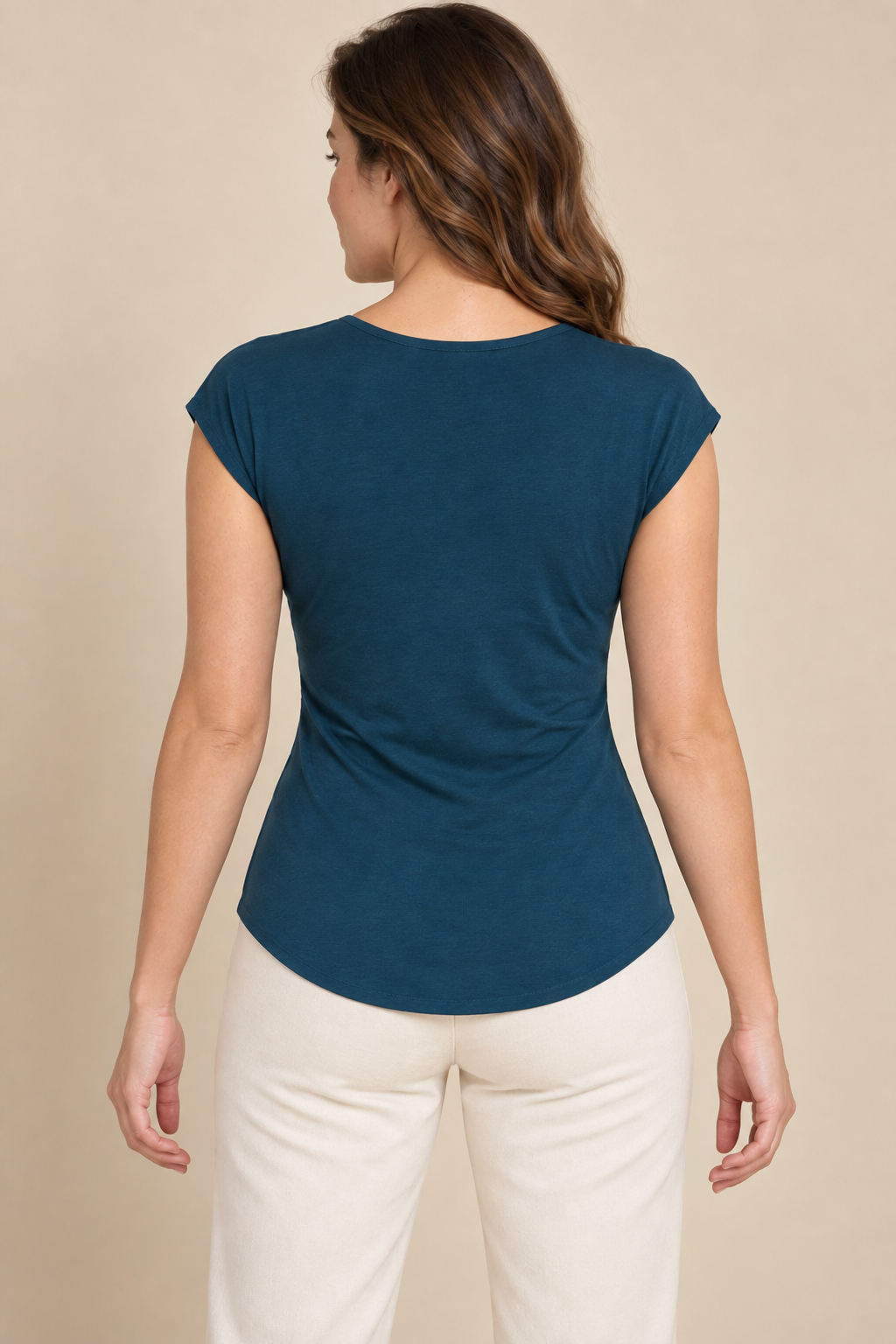 AI preview: rear of the same petrol jersey top with a high round neckline, cap shoulders and a smooth closed back.