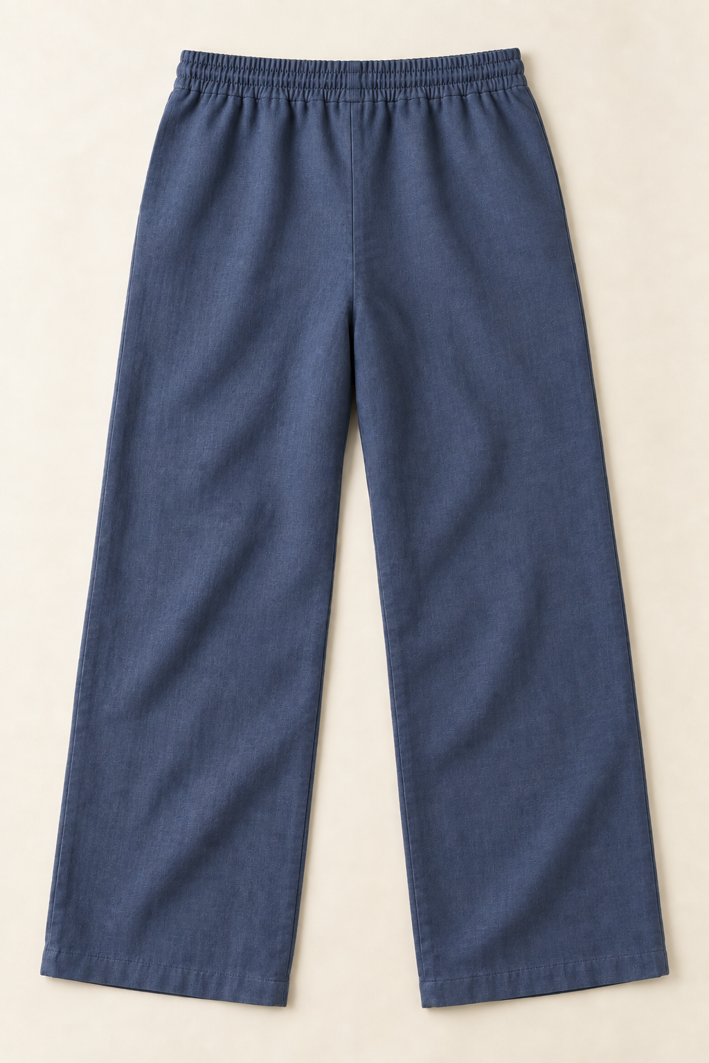 AI preview: plain rear of indigo men's linen trousers with a fully elastic waistband, wide straight legs and no back pockets.