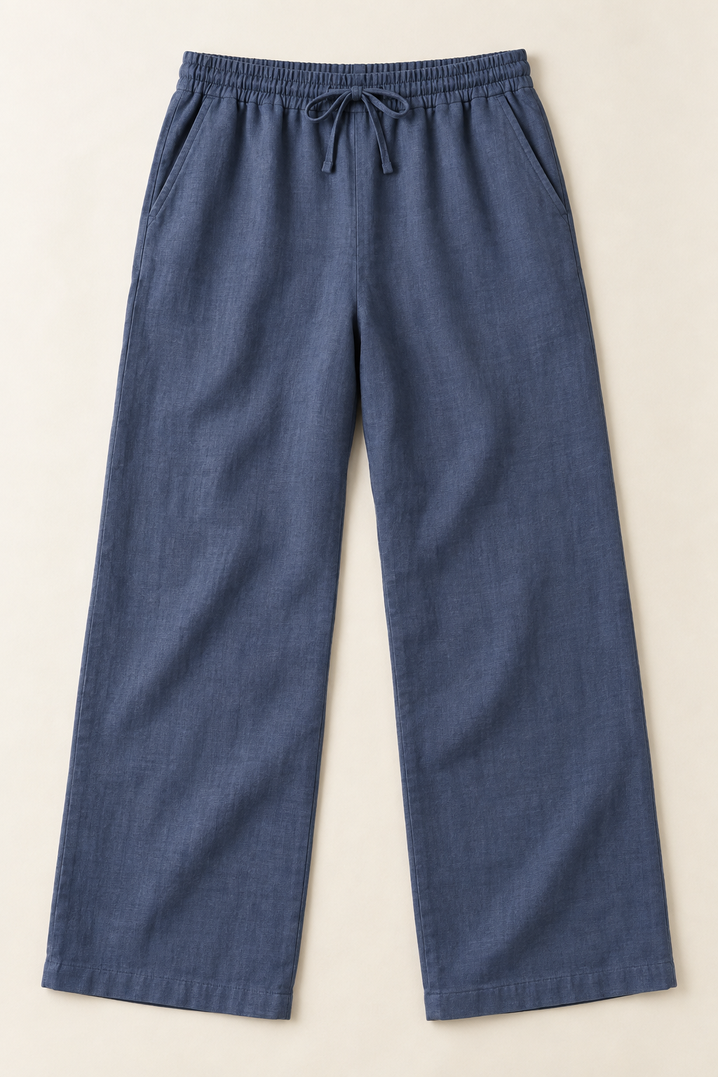 AI preview: men's dusty indigo linen trousers with a full elastic drawcord waist, diagonal inset pockets and straight wide legs.