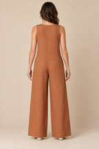 AI preview: copper jumpsuit rear with a high round neckline, continuous closed back and plain wide legs.