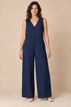 AI preview: the same collarless button-front wide-leg jumpsuit in rich navy linen.
