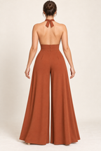 AI design preview: open back of the sienna cross-halter jumpsuit with short neck ties, concealed center-back zipper and wide legs