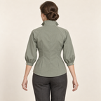 AI design preview: sage blouse rear showing raglan seams, a closed high collar, center-back seam and paired waist darts