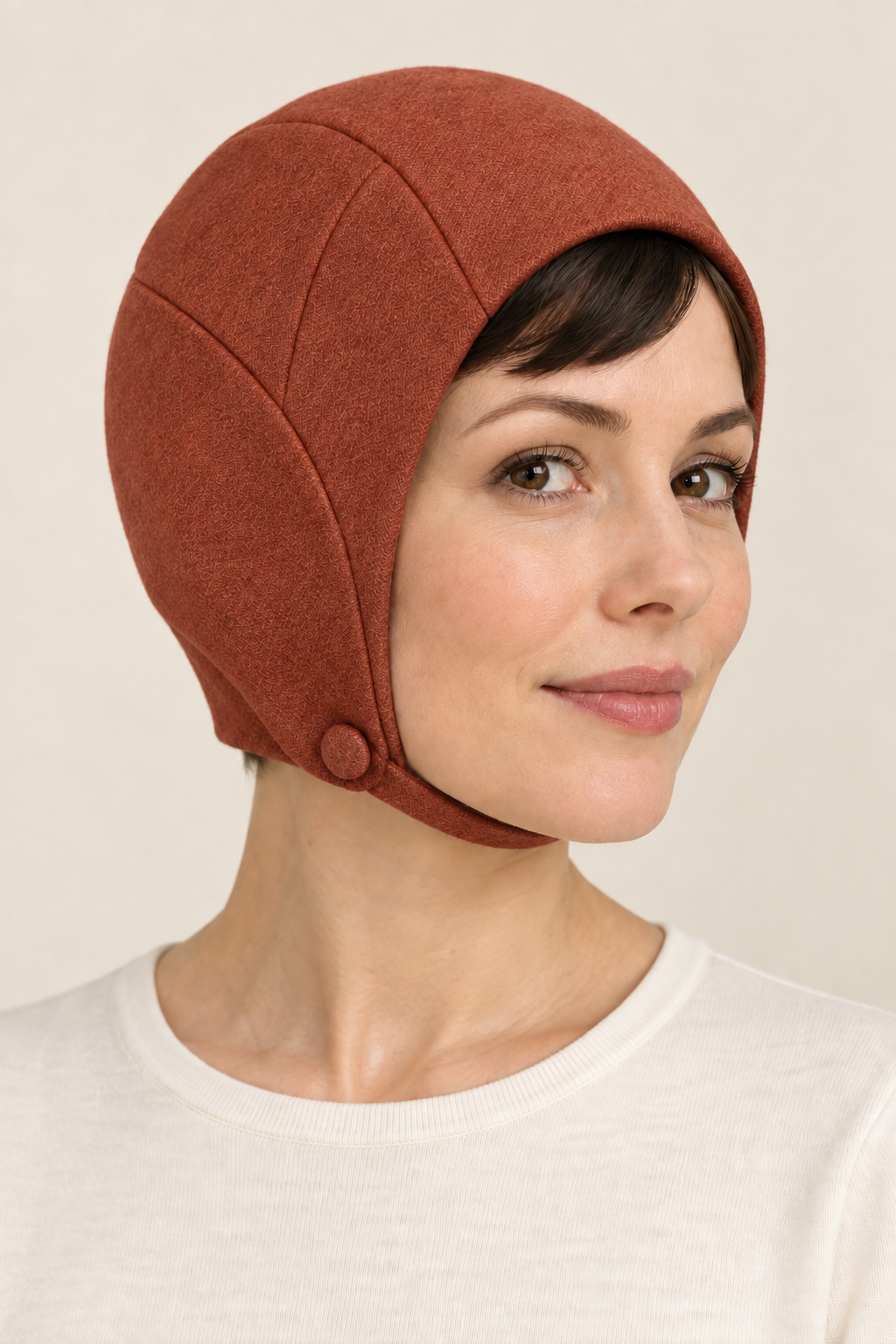 AI design preview: terracotta color of the same close-fitting mod hat with ear coverage and a single-button chin strap