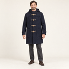 AI design preview: navy men’s hooded duffle coat with four toggles, shoulder overlays, patch pockets and wrist tabs