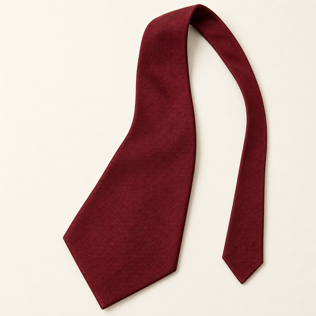 AI design preview: front face of an unknotted burgundy wide pointed kipper necktie with a narrow tail
