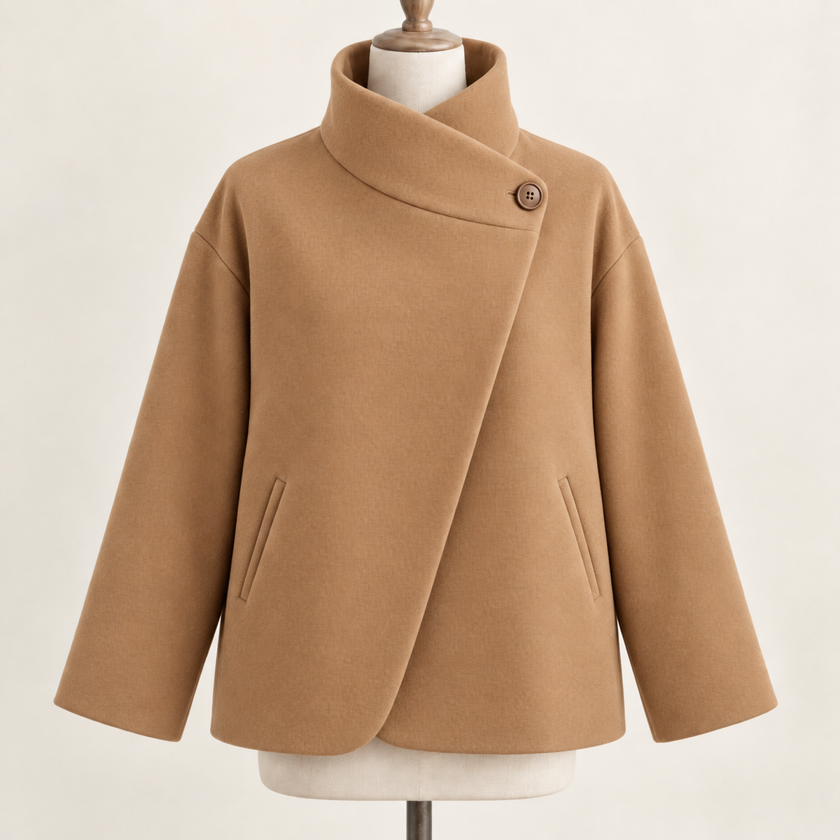 AI design preview: warm camel color of the same one-button asymmetric funnel-neck jacket with diagonal front and two slanted welt pockets