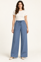 AI design preview: denim-blue wide-leg pants with fully elastic drawstring waist and two oversized slant-entry exterior front patch pockets