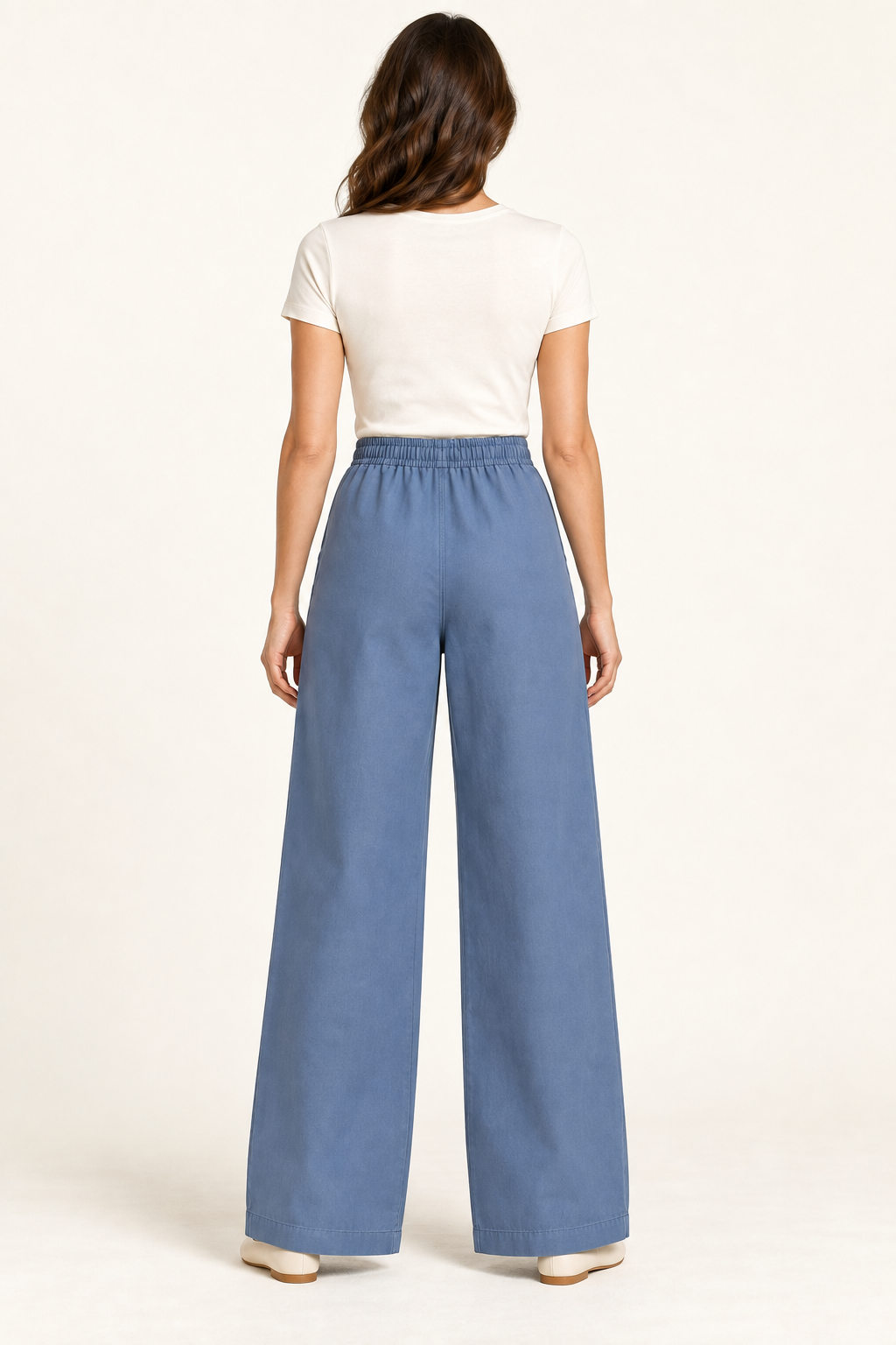 AI design preview: denim-blue wide-leg pants rear with fully gathered elastic waistband, plain back and full-length turned hems