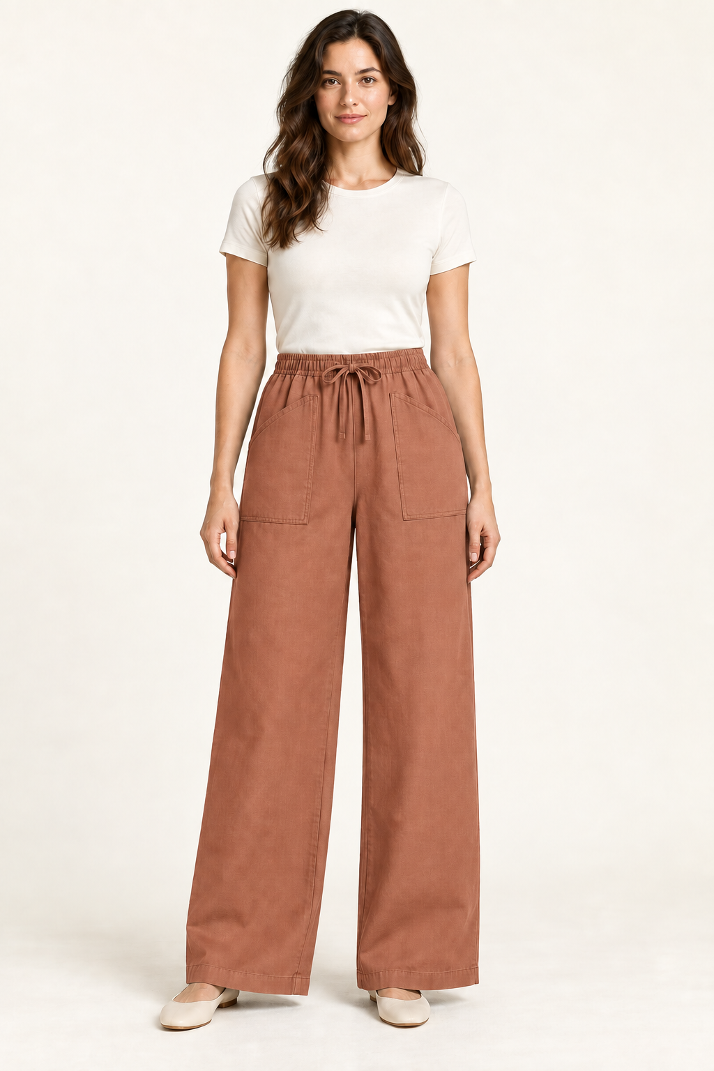 AI design preview: warm-clay version of the same drawstring wide-leg pants with two oversized front patch pockets