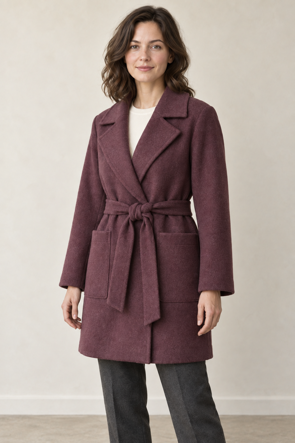 AI design preview: closer three-quarter view of the same mulberry coat showing the notched collar, tied sash and rectangular patch pockets