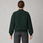AI design preview: forest-green varsity jacket rear with dropped shoulders, plain back, rib cuffs and rib hem