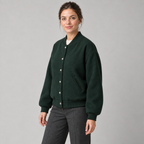 AI design preview: three-quarter front of the same forest-green varsity jacket with six snaps and ribbed edges