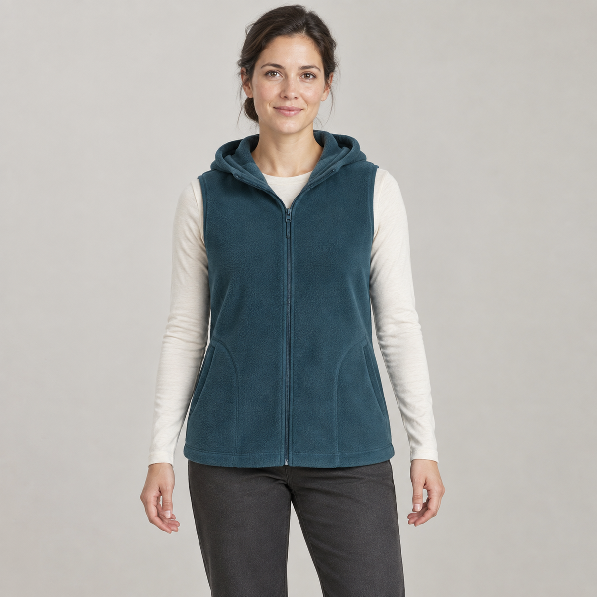 AI design preview: adult woman wearing a petrol-teal hooded zip fleece vest with curved-entry pockets, front view