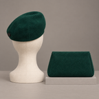AI design illustration of the emerald beret from behind beside the pochette's plain rear panel and defined side welts