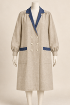 AI design concept: natural flax artist smock coat with indigo lapels and pocket bands, front.