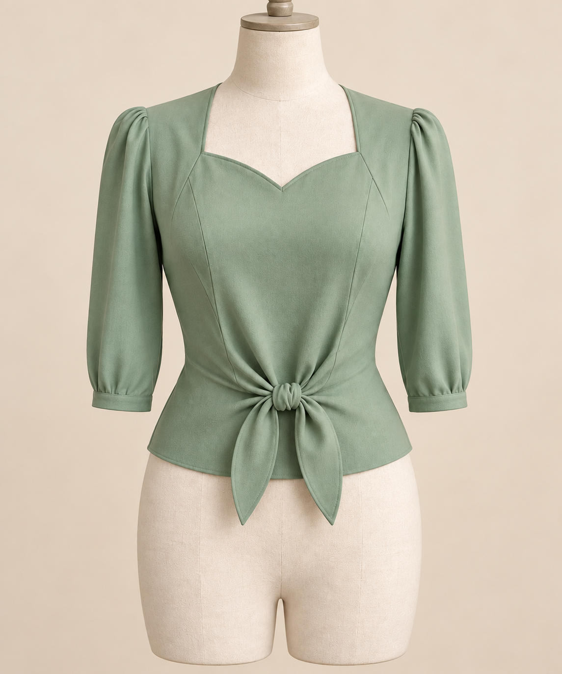 AI front preview of a pale-jade 1940s sweetheart tie-front blouse with three-quarter sleeves
