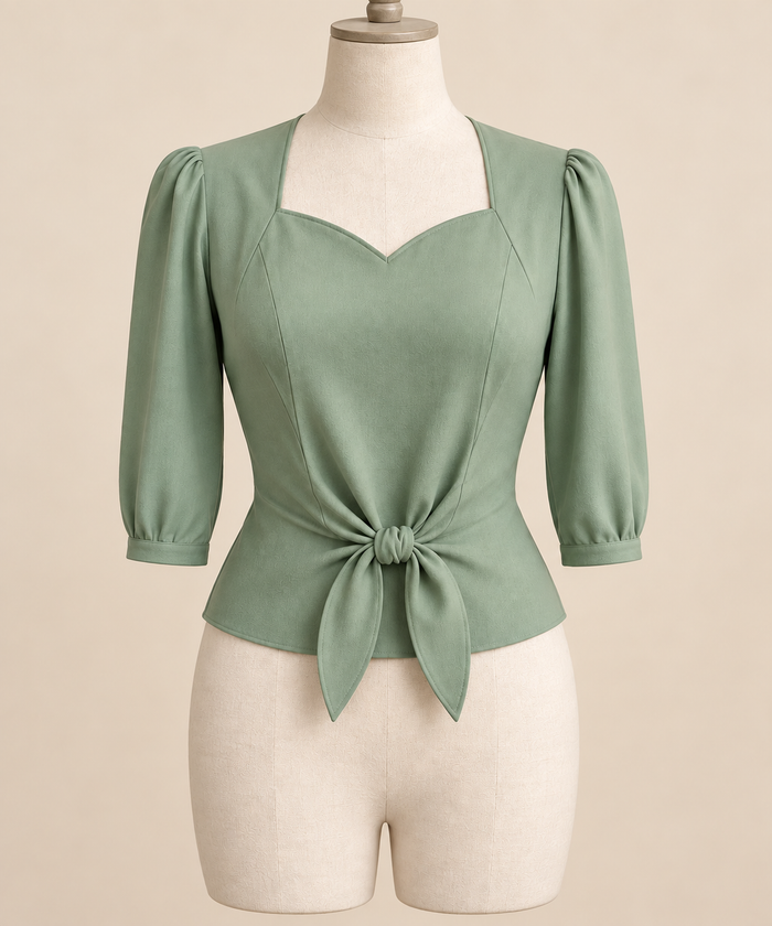 AI front preview of a pale-jade 1940s sweetheart tie-front blouse with three-quarter sleeves