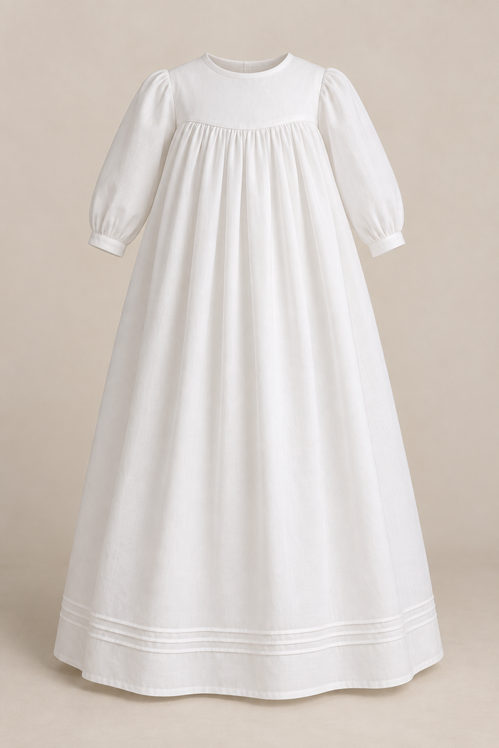 AI garment-only front preview of a white long baby yoke gown with long banded sleeves, gathered body and three hem tucks