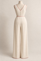 AI design preview: back of cream one-piece long pajama with a bound V neckline and three covered buttons.