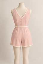 AI design preview: blush-pink short-leg pajama back with V neckline, three covered buttons and joined waist.