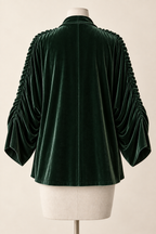 AI design preview: back of green velvet shrug with smooth center seam and gathered outer sleeves.