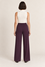 Plum bias-cut wide-leg trousers with an elastic waist, back view on a woman; generated design preview.