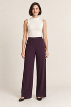 Plum bias-cut wide-leg trousers with an elastic waist, front view on a woman; generated design preview.