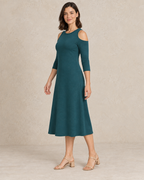 Three-quarter view of the cold-shoulder dress design showing the shoulder opening and gentle A-line skirt