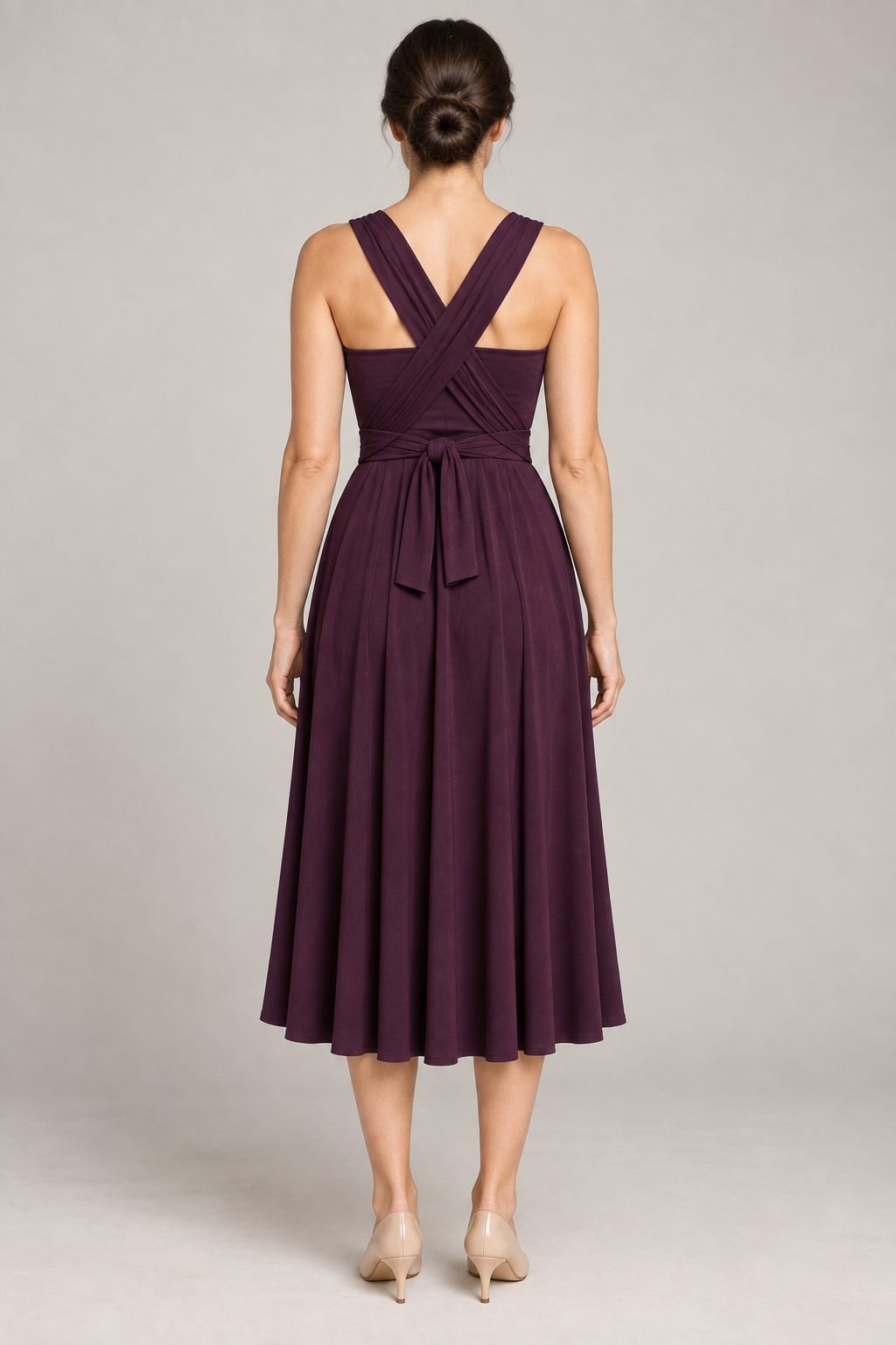 Back design preview of a convertible infinity dress with crossed shoulder panels, a center-back waist tie and matching bandeau.