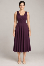 Front design preview of a deep-plum convertible infinity dress with broad crossed wrap panels and a flowing midi skirt.