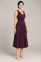 Three-quarter design preview of a plum infinity dress showing the crossed neckline, wrapped waist and matching bandeau coverage.