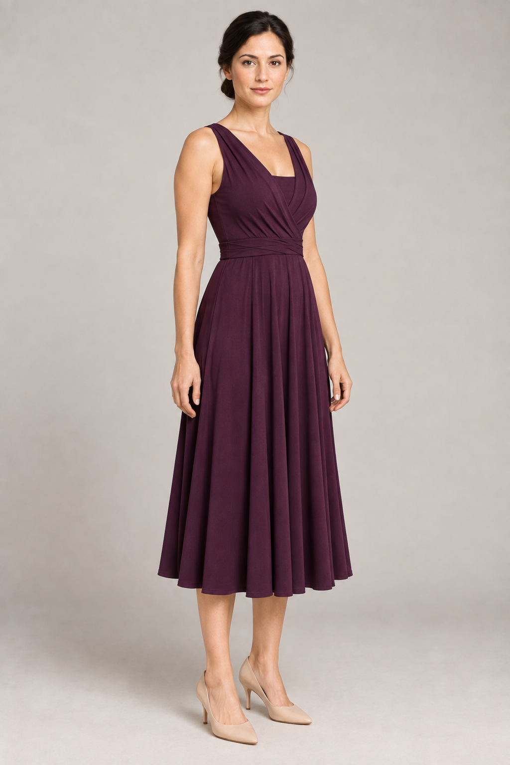 Three-quarter design preview of a plum infinity dress showing the crossed neckline, wrapped waist and matching bandeau coverage.