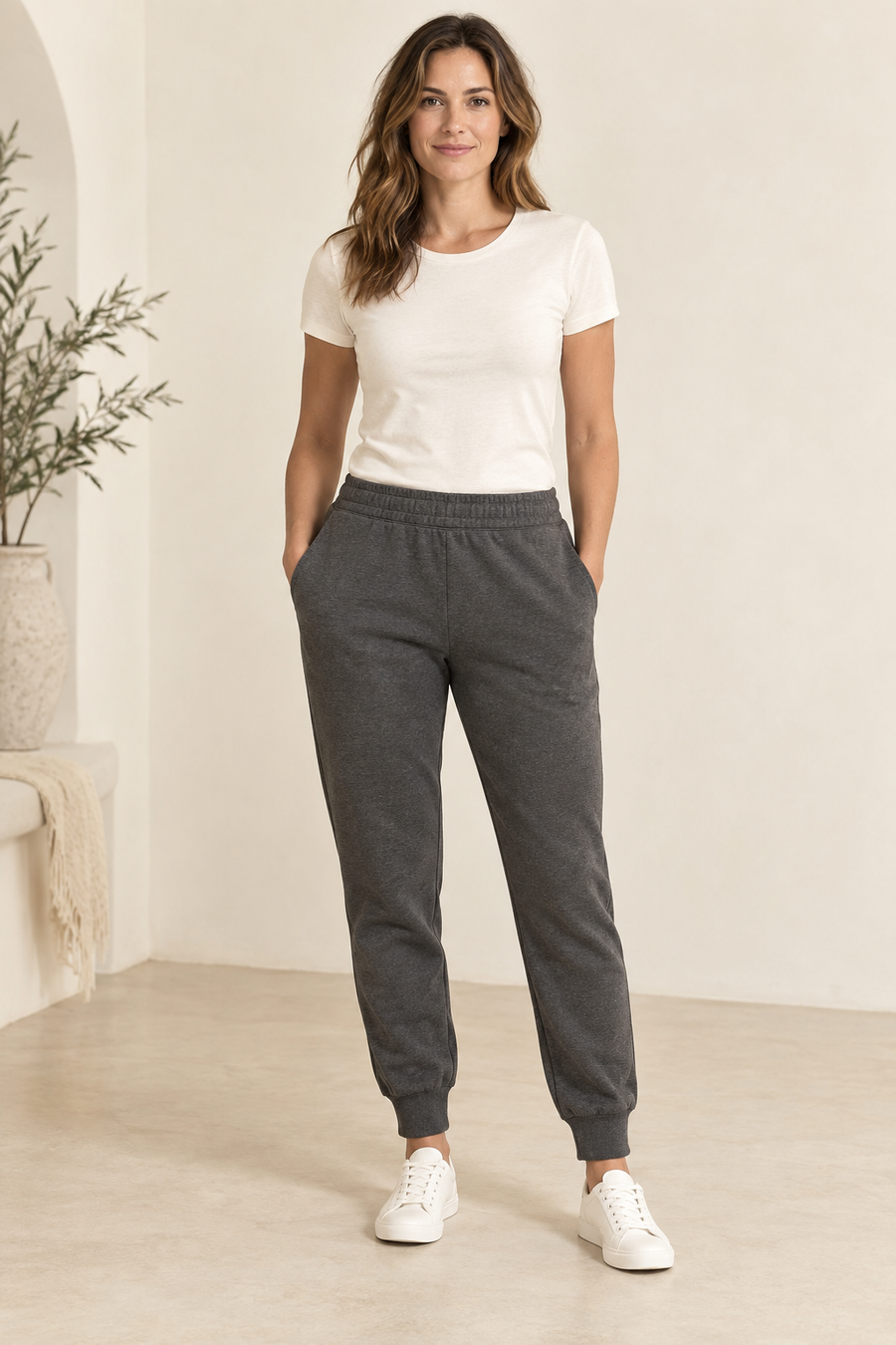 Design preview of cuffed knit joggers, front view on an adult model.