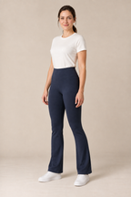 Three-quarter view of ink-navy high-waisted flared leggings with a plain broad waistband. Generated design preview.
