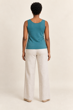 Back view of knit vest top design on a model