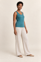 Three-quarter view of knit vest top design on a model