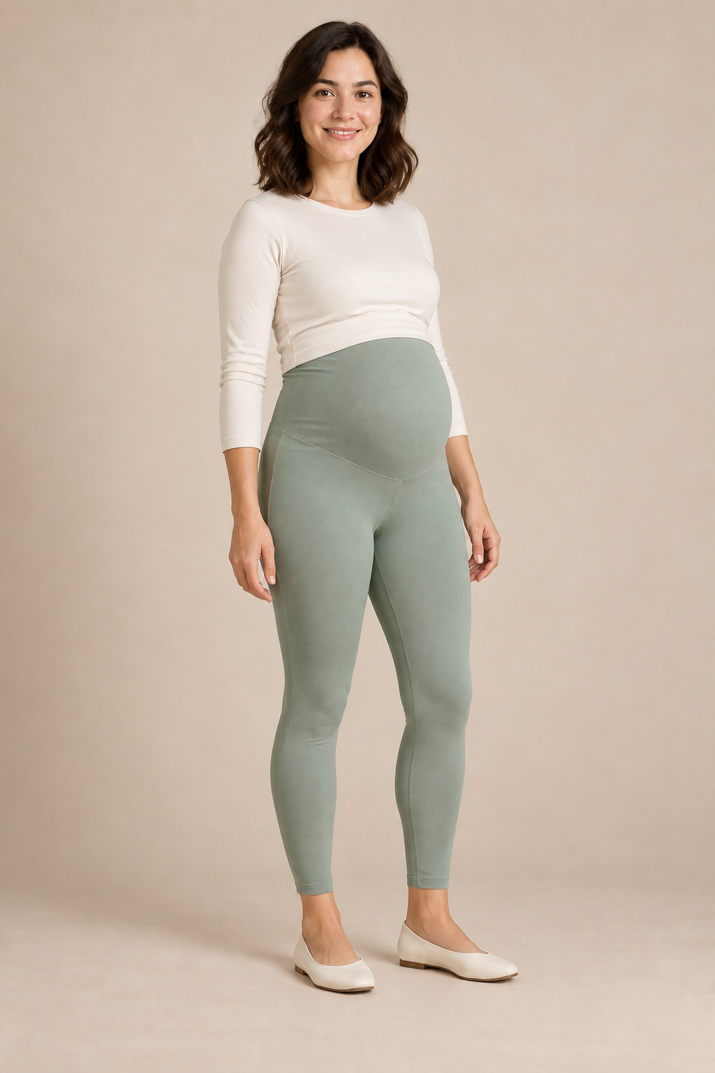 Three-quarter view of sage-green maternity leggings with a soft over-bump panel and ankle-length legs. Generated design preview.
