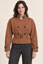 AI preview: muted-cinnamon color option of the same stand-collar cropped trench jacket with a rectangular-buckle belt.