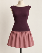AI preview: plum knit boat-neck bodice joined at the low hip to a gathered dusty-rose woven mini skirt.