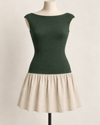AI preview: forest-green knit and warm-oat woven color option of the same drop-waist mini dress.
