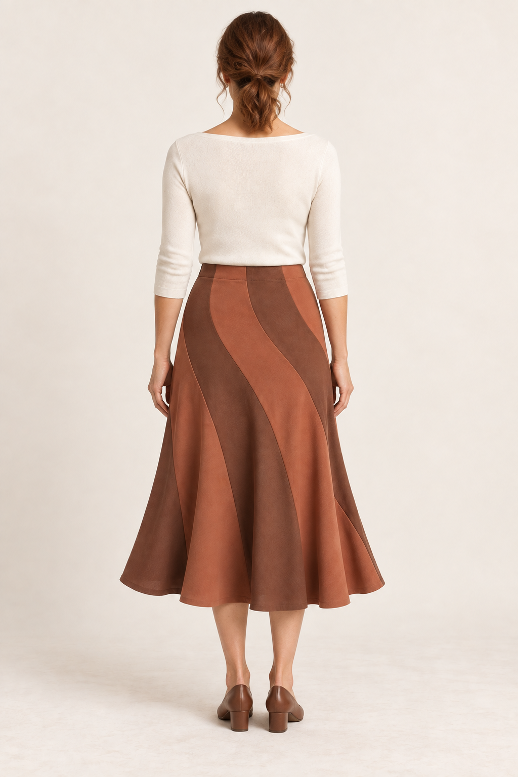 Terracotta and cinnamon spiral-panel midi skirt, back view on a woman; generated design preview.