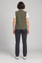 Back view of an olive four-pocket utility vest design on a woman