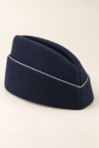 AI design preview: opposite three-quarter angle of the navy garrison cap, showing the seamed end and piped band.